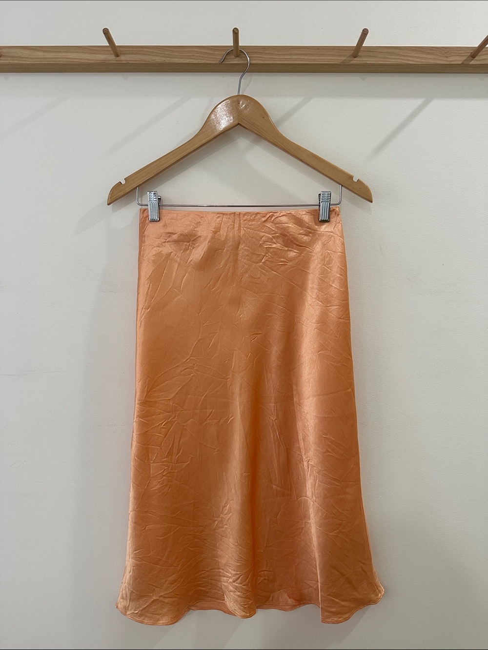 Babaton Satin Midi Skirt in Peach Orange
